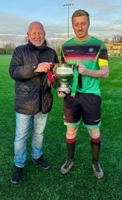 Chris Boyd receiving McAleavey Cup 2023 from League Chairman Alan McClune